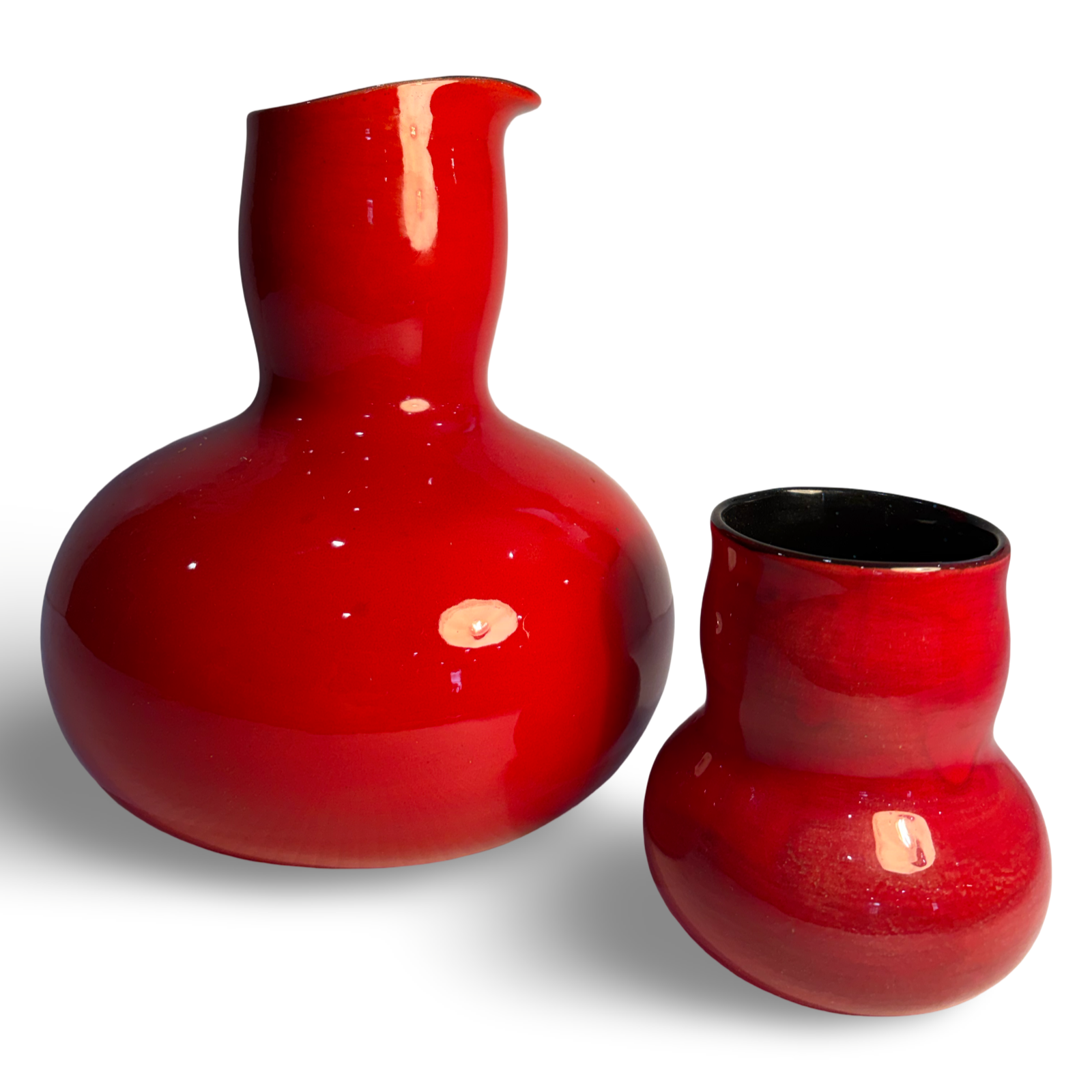 Unique red carafe and drinking vessel