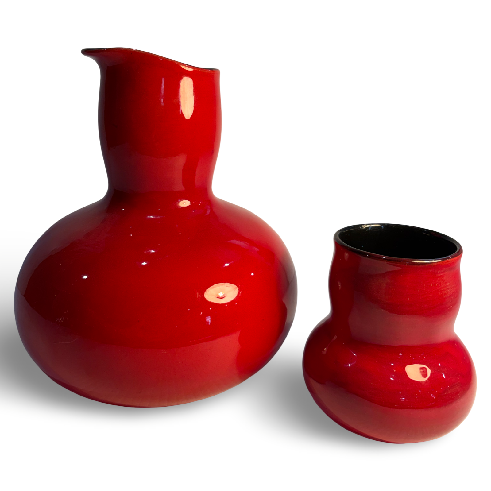 Unique red carafe and drinking vessel
